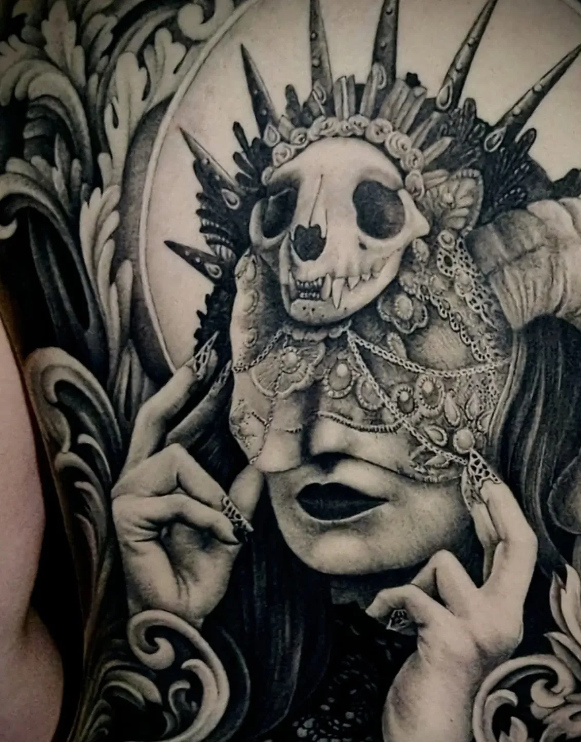 Gothic-inspired woman portrait tattoo with ornate decorative elements